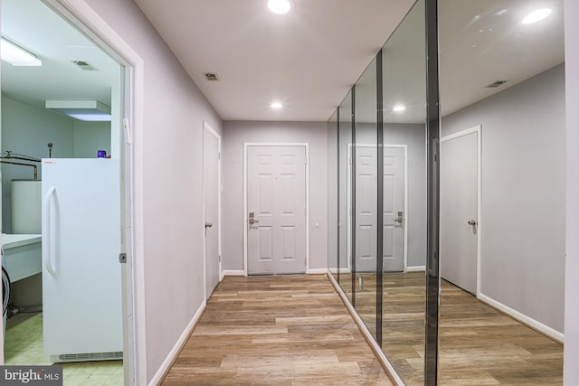 hall featuring light hardwood / wood-style floors