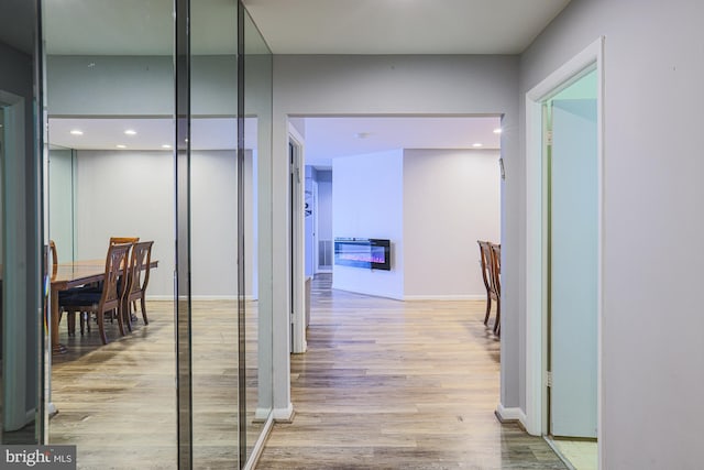 hallway featuring light wood-type flooring