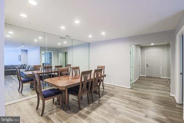 dining area with light wood-type flooring