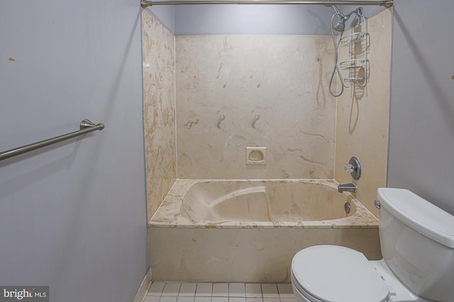 bathroom featuring toilet, tile patterned floors, and shower / bathtub combination