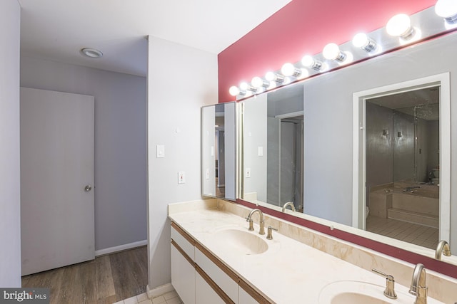 bathroom featuring hardwood / wood-style floors and vanity