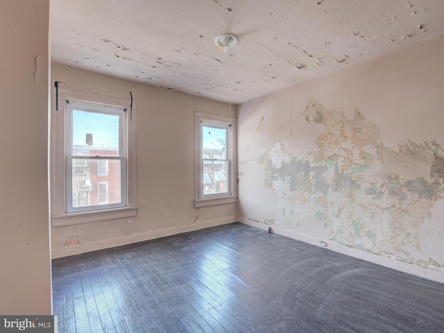 empty room with dark wood-type flooring