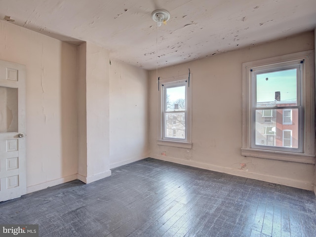 spare room featuring dark hardwood / wood-style floors