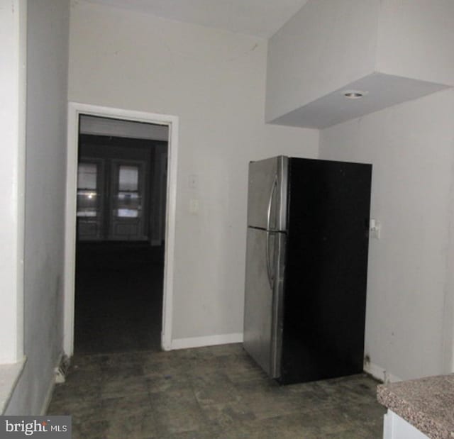 kitchen featuring stainless steel refrigerator