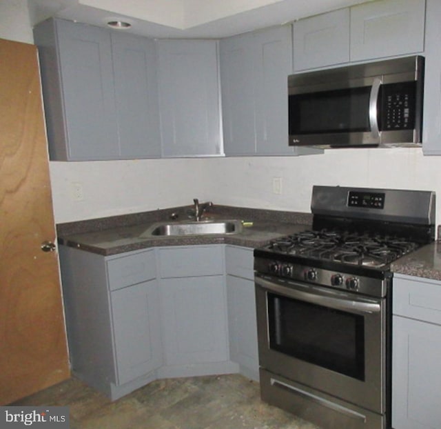 kitchen with appliances with stainless steel finishes and sink