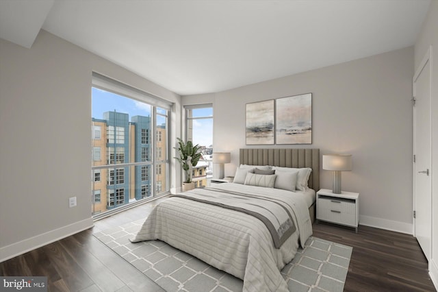 bedroom featuring dark hardwood / wood-style flooring