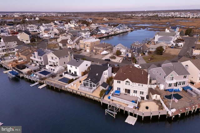 aerial view at dusk with a water view