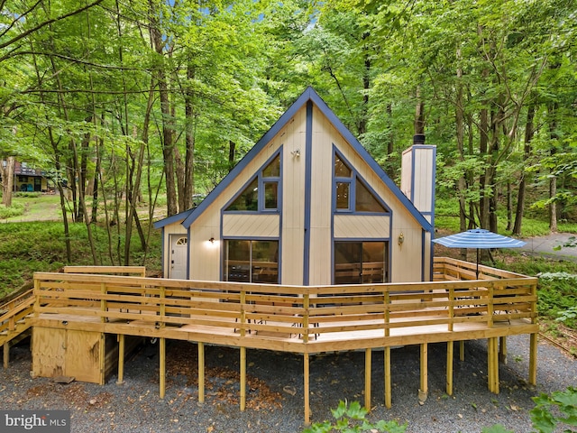 back of property featuring a wooden deck