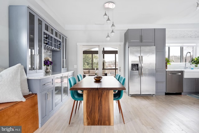 dining room featuring light hardwood / wood-style flooring and sink