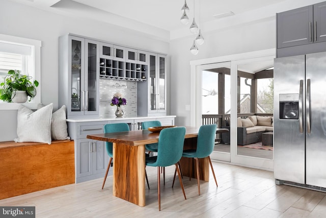 dining space featuring light wood-type flooring