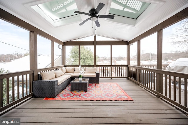 sunroom with ceiling fan and vaulted ceiling