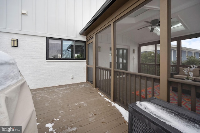 wooden deck featuring ceiling fan