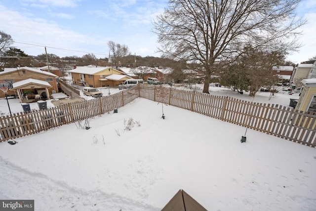 view of yard layered in snow