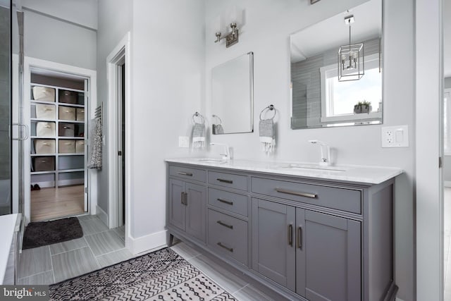 bathroom featuring vanity and a shower with shower door