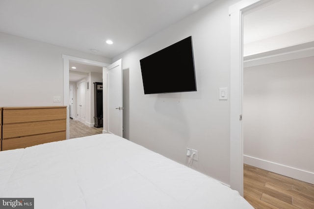 bedroom with light wood-type flooring