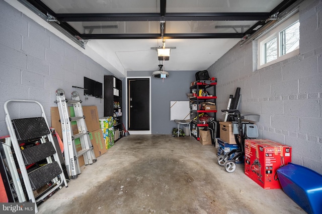 garage featuring a garage door opener