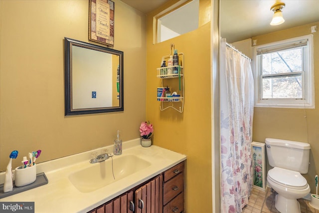 bathroom with walk in shower, vanity, and toilet