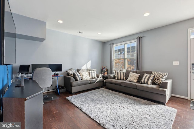 living room with dark hardwood / wood-style flooring