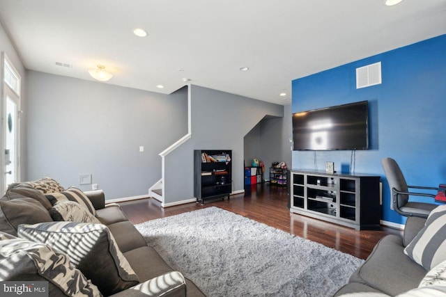 living room featuring dark wood-type flooring