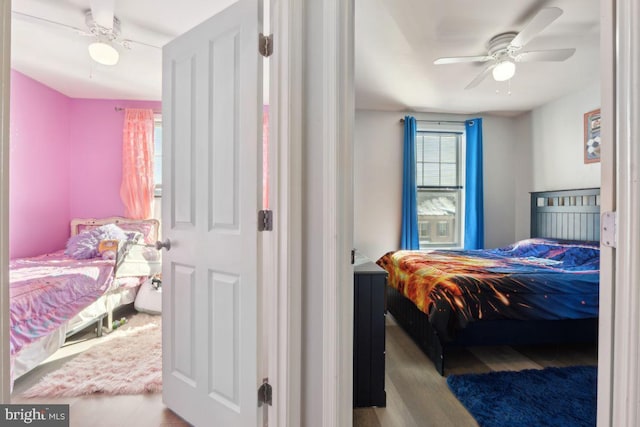 bedroom featuring light hardwood / wood-style flooring and ceiling fan