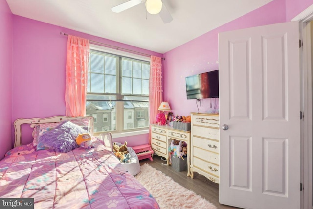 bedroom with ceiling fan and hardwood / wood-style floors