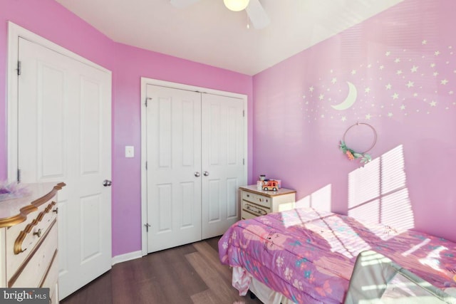 bedroom with ceiling fan, dark hardwood / wood-style flooring, and a closet