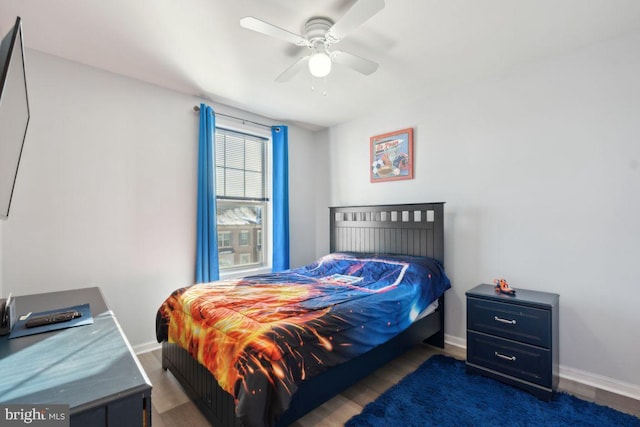 bedroom featuring ceiling fan and dark wood-type flooring