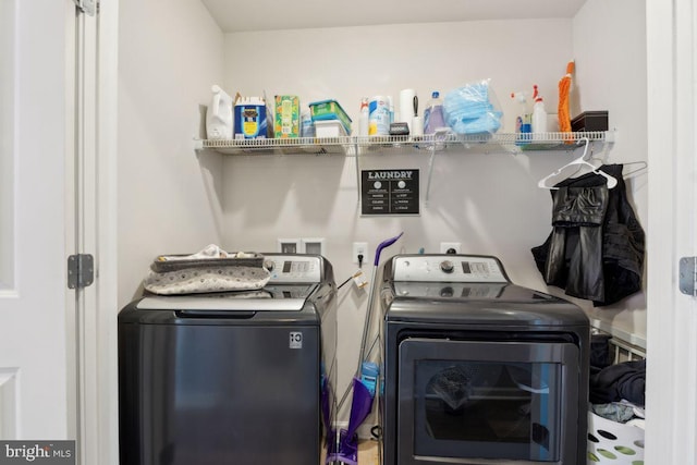 laundry area with independent washer and dryer