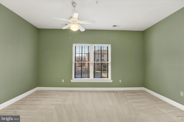 carpeted empty room with ceiling fan