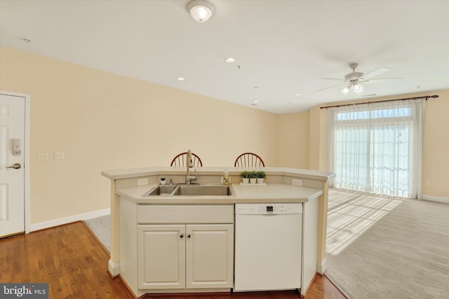 kitchen featuring sink, white cabinetry, dishwasher, ceiling fan, and light hardwood / wood-style floors