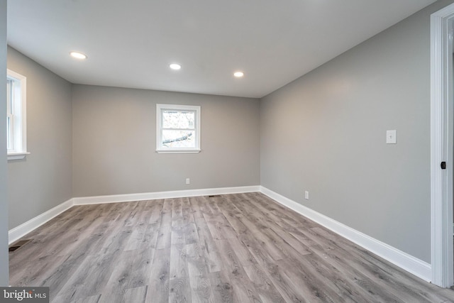 spare room featuring light wood-type flooring