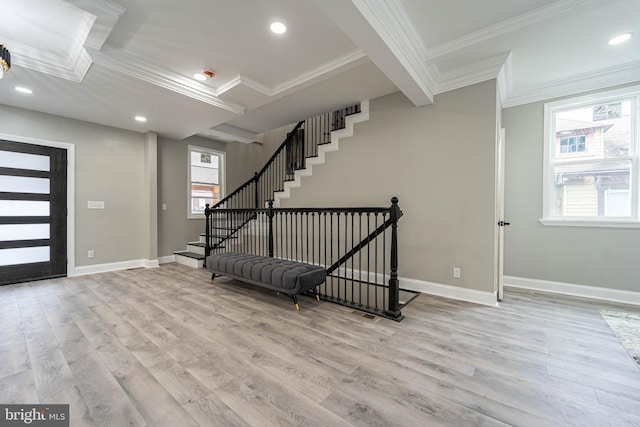 entrance foyer with beam ceiling, light hardwood / wood-style floors, and crown molding