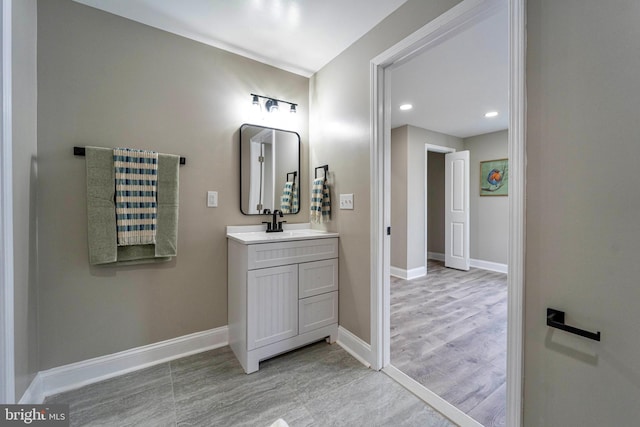 bathroom featuring vanity and wood-type flooring