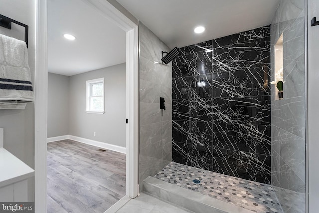 bathroom featuring a tile shower