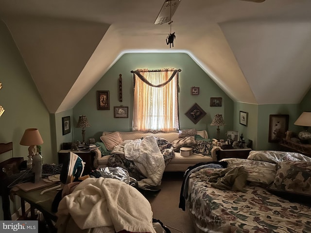 bedroom with carpet and vaulted ceiling