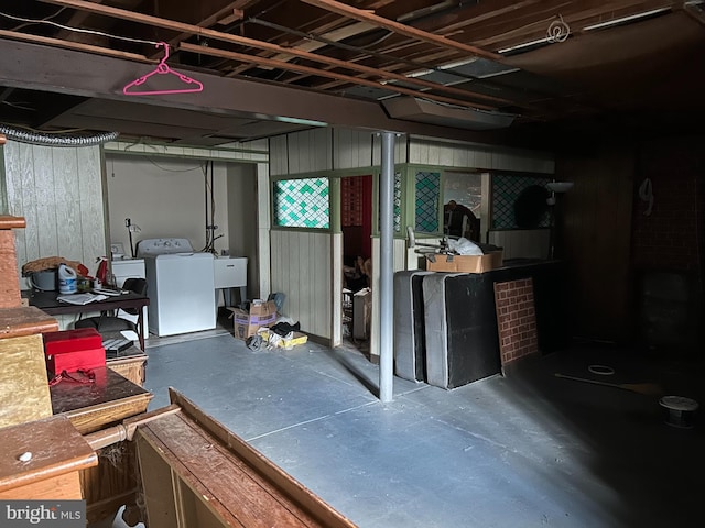 basement with separate washer and dryer and sink