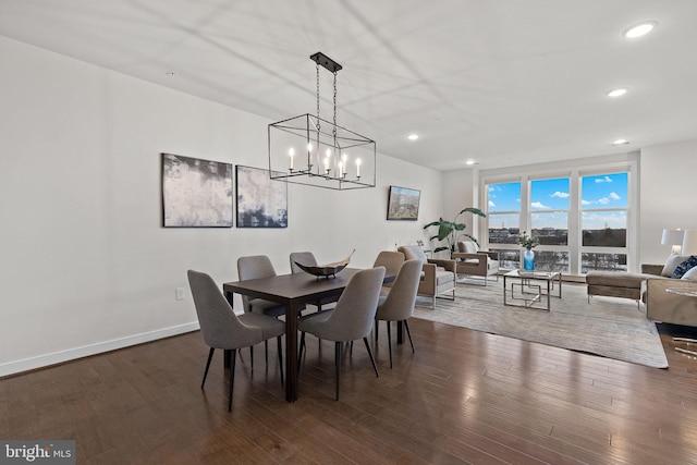 dining space with dark hardwood / wood-style flooring