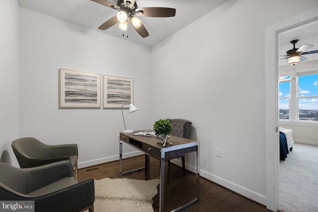 home office featuring ceiling fan and dark hardwood / wood-style floors