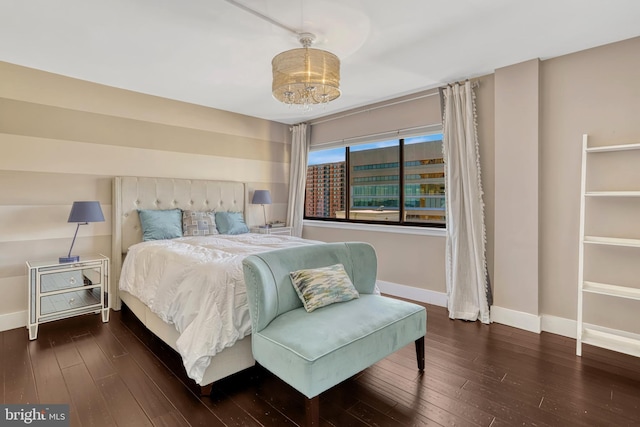 bedroom with dark hardwood / wood-style flooring