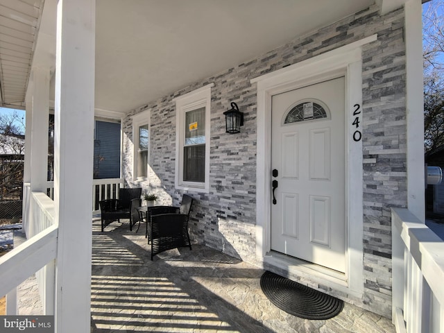 entrance to property with covered porch