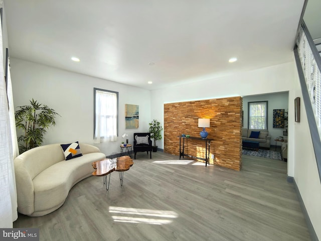 living room with hardwood / wood-style flooring and a wealth of natural light