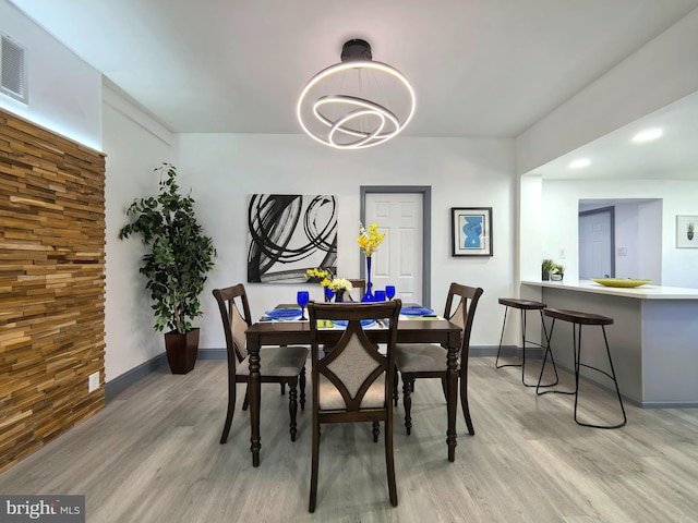 dining space with light wood-type flooring