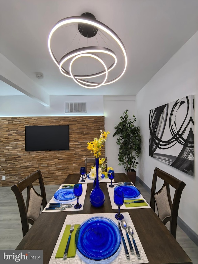 dining space with hardwood / wood-style floors