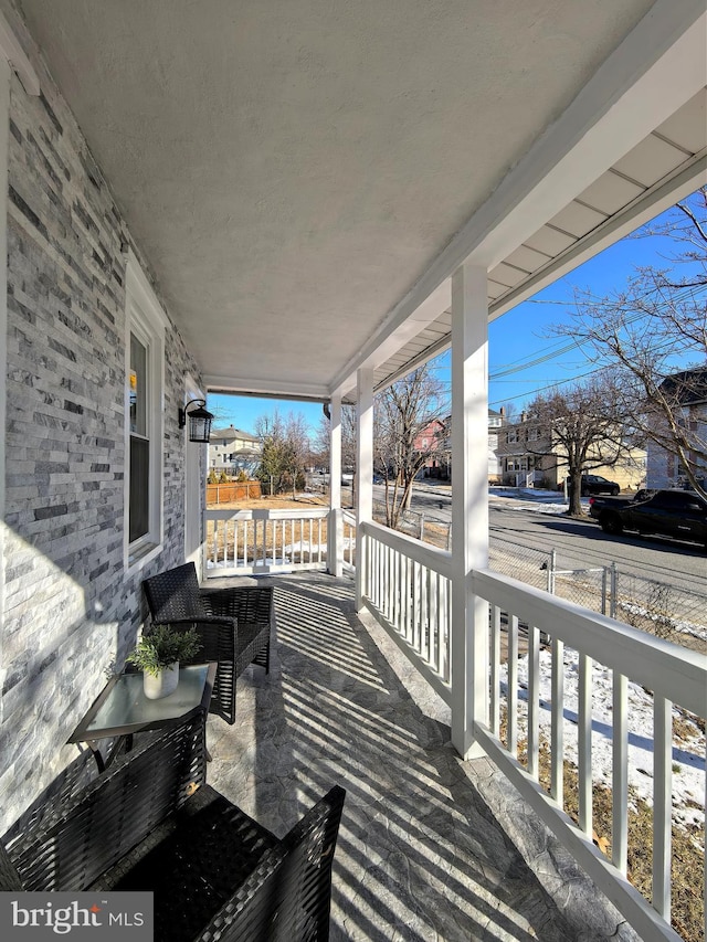 wooden deck featuring a porch