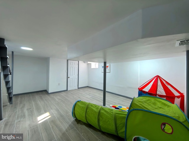 basement featuring hardwood / wood-style floors