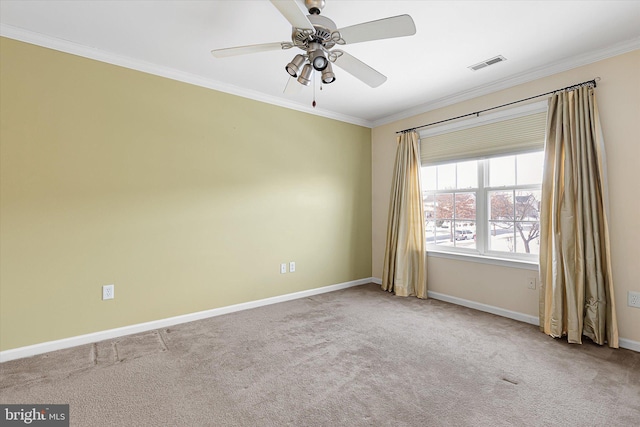 unfurnished room featuring ceiling fan, crown molding, and light carpet