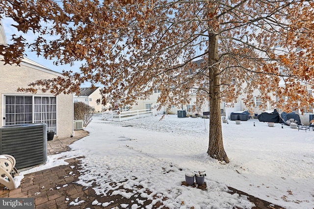 snowy yard with cooling unit