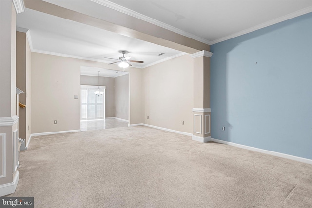 empty room featuring light colored carpet, ceiling fan, and crown molding