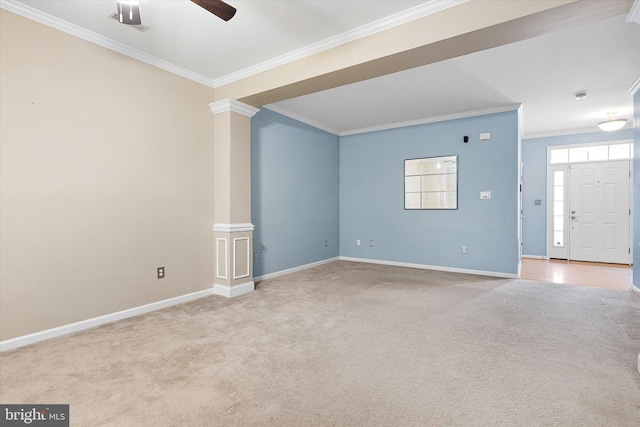 interior space featuring ceiling fan, ornamental molding, light carpet, and ornate columns