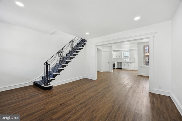 unfurnished living room featuring dark hardwood / wood-style flooring